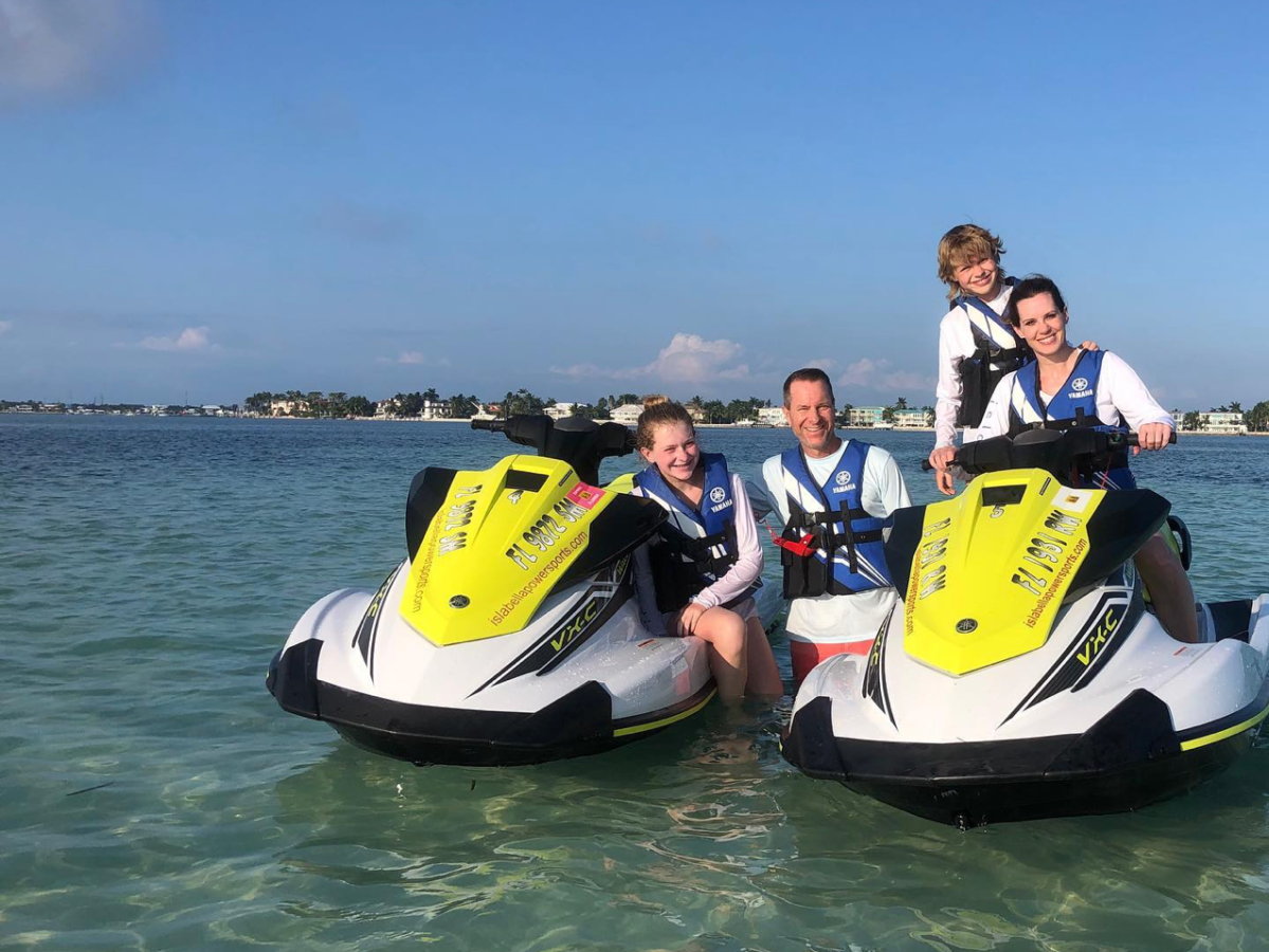 a group of people riding on the back of a boat